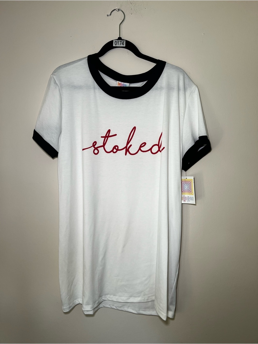 LuLaRoe White Graphic Tee with Black Trim and Red Script “Stoked”